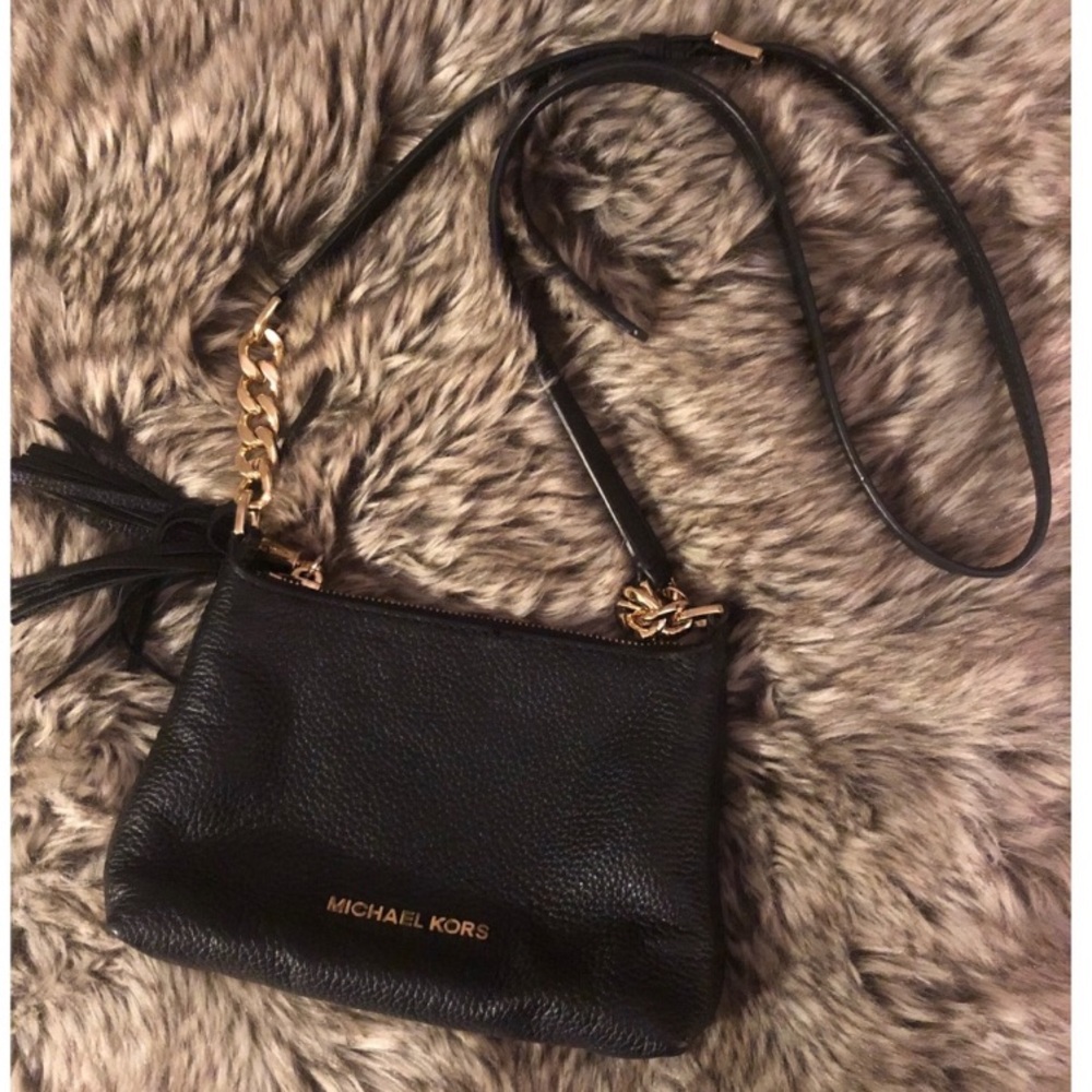 Black Leather Micheal Kors crossbody purse with tassel